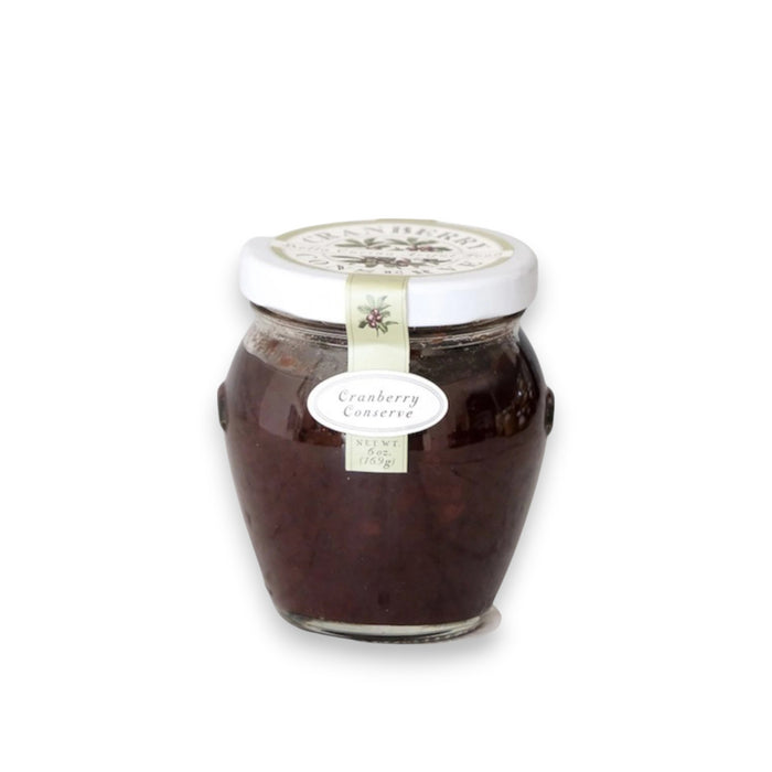 A small jar of BELLA CUCINA - CRANBERRY CONSERVE makes the perfect holiday gift. The white lid and decorative band add a festive touch, while the dark red preserve inside is a pantry essential.
