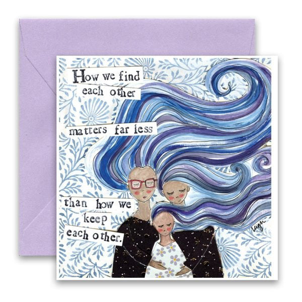 The CURLY GIRLS DESIGNS - HOW WE KEEP EACH OTHER GREETING CARD by CURLY GIRL DESIGN, INC features three people embracing with blue swirls and the message: "How we find each other matters far less than how we keep each other." Includes a light purple envelope.
