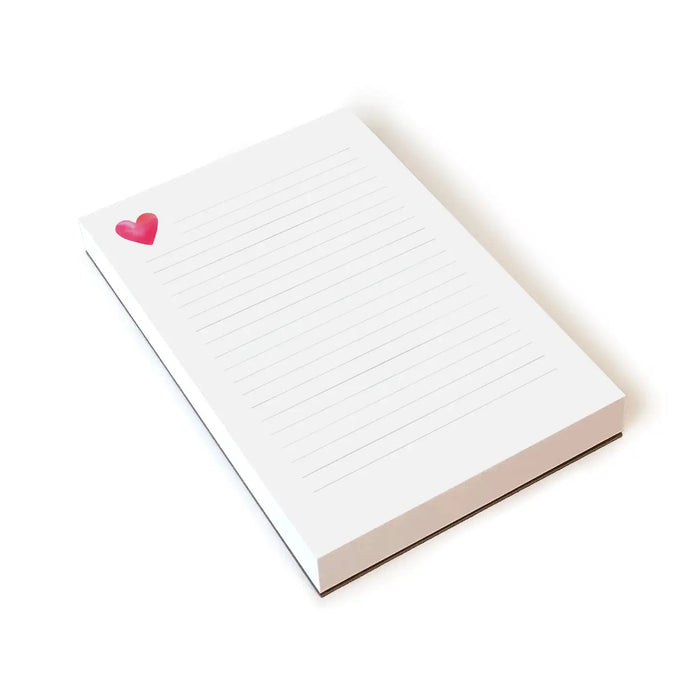 The E. Frances Paper Heart Lined Notepad boasts a charming pink and red heart illustration in the top left corner, reflecting the brand's commitment to quality products that blend style with functionality.