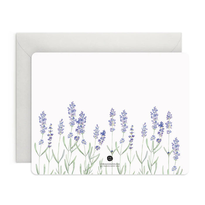 A box of E. FRANCES PAPER's LAVENDER FLAT NOTES, ideal for sharing thoughtful words. The front card displays a delicate watercolor of lavender flowers, while the pastel green packaging features a minimalist design, making it a perfect small gift.