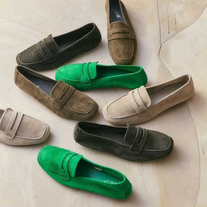 REQINS - HEMA suede loafers in olive feature a classic silhouette, flat sole, decorative upper strap, and comfortable leather insole, shown in side profile against a plain light background.