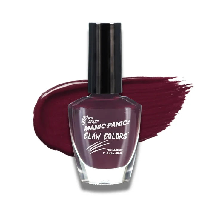 Manic Panic glossy nail polish bottle with a swatch of dark red nail lacquer color on a white background