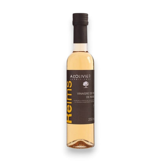 A bottle of ATALANTA CORPORATION A L'OLIVIER WHITE WINE VINEGAR REIMS with a black label and cap, displayed against a white background.