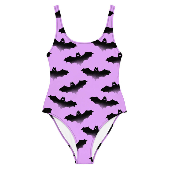 Aensland pastel-goth one-piece swimsuit in pink with watercolor bats and drifting clouds