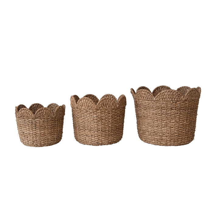 The CREATIVE COOP BRAIDED BANKUAN & RATTAN BASKET (LARGE) features eco-friendly, light brown natural fibers and scalloped edges, providing stylish storage and organization against a plain white background.