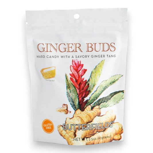 A white pouch labeled "BUTTERFIELDS - GINGER BUDS" shows ginger root and flower. The packaging highlights "Hard candy with a savory natural ginger tang," "Gluten Free," "BUTTERFIELDS," and "Net Wt 2.5oz (60 grams).