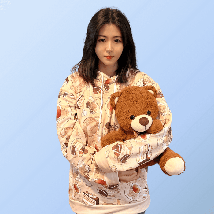 Latte kawaii Café hoodie with heart-shaped teacups and chocolate macarons