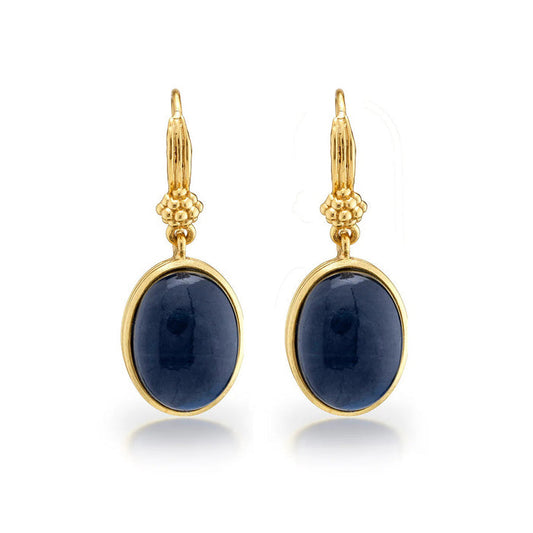 CAPUCINE DE WULF’s Cleopatra Oval Drop Blue Labradorite Earrings feature oval blue labradorite gemstones in gold frames with bead accents—an elegant example of artisan jewelry.