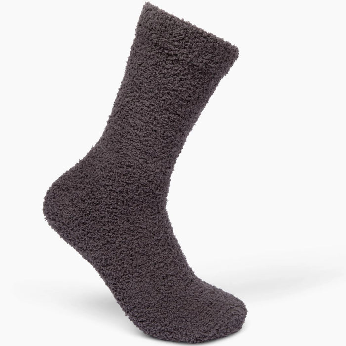 Beige fuzzy socks made from soft plush material are wrapped in a white "Cozy Cloud Socks" label displaying "Giften Market" and "GIFTENMARKET.COM." These women's socks are neatly folded and viewed from above on a plain background.