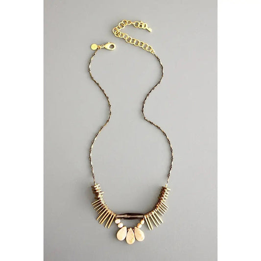 The DAVID AUBREY - ATHENA PEARL SMOKEY QUARTZ NECKLACE features a delicate gold chain, adjustable clasp, and fan-shaped pendant with cream and gold accents—a perfect handcrafted Mother's Day gift from DAVID AUBREY, shown on a gray background.