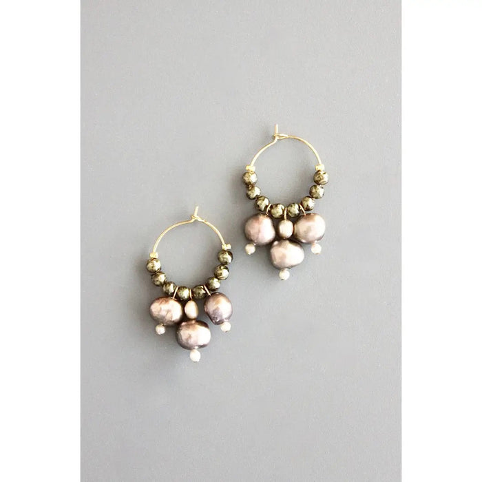 The DAVID AUBREY Glass and Fresh Water Pearl Hoop Earrings feature 18k gold plating, metallic beads, clusters of freshwater pearls, and white beads—a stunning handcrafted piece from DAVID AUBREY.