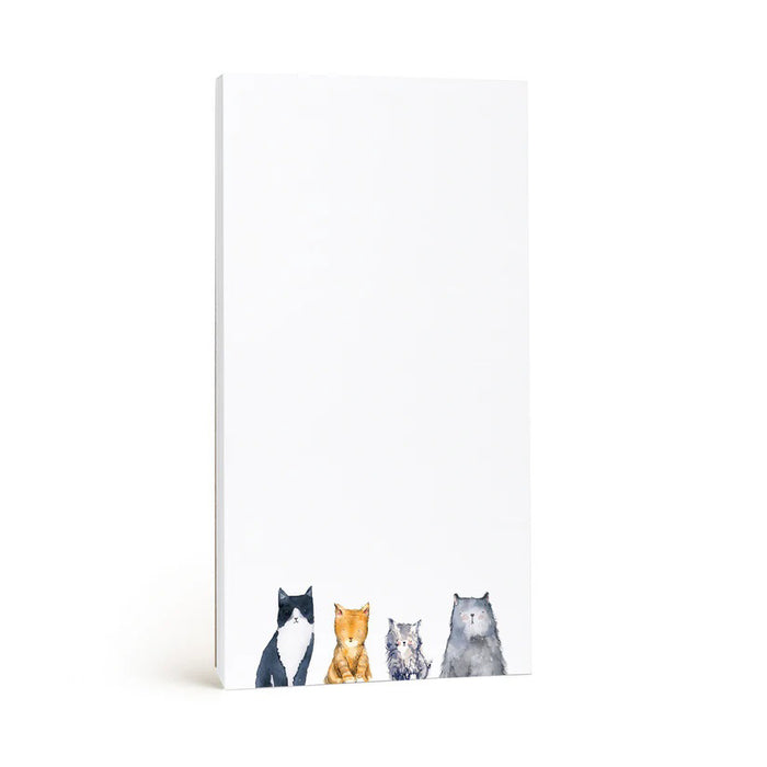 E. FRANCES PAPER's CATS NOTEPAD, made in the USA, features a minimalistic design with recycled paper and charming illustrations of black & white, orange, gray, and brown cats along the bottom edge. The crisp white background offers ample blank space.