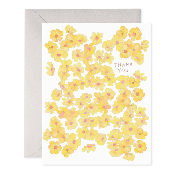 The E. FRANCES PAPER - YELLOW FLOWERS THANK YOU GREETING CARD features floral illustrations of yellow flowers with pink centers and "Thank You" written in uppercase letters among the blossoms, complete with an envelope.