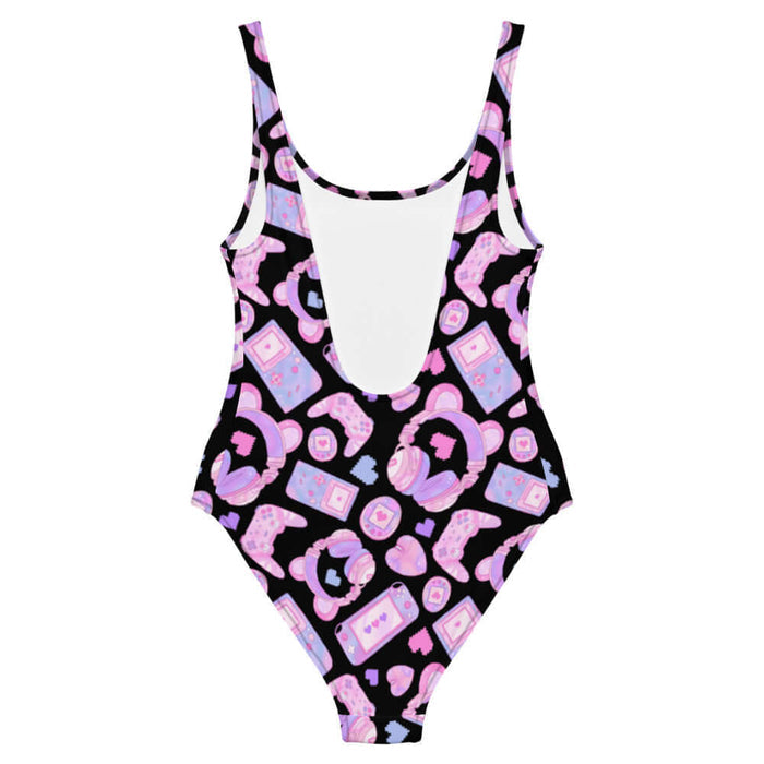 Gamer Girl kawaii one-piece swimsuit in pink with twin joysticks and pastel handhelds