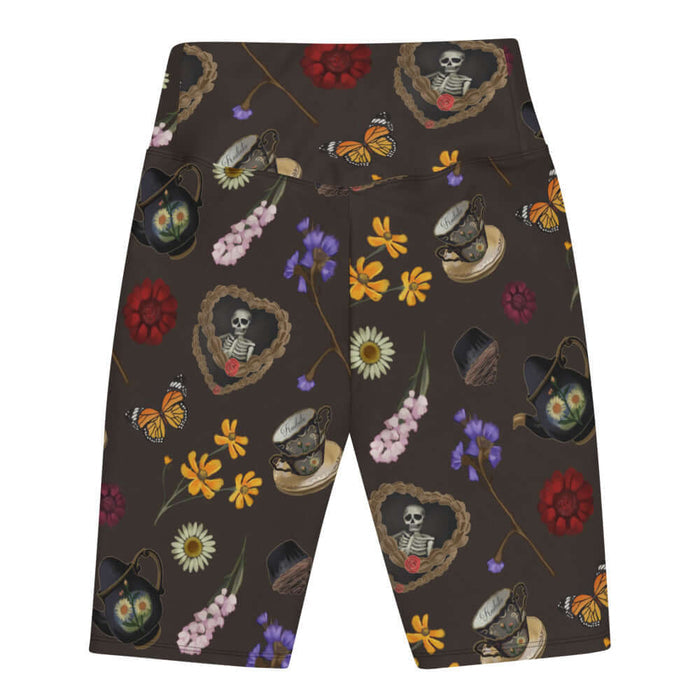 Gothic Tea Time biker shorts in black with a rose-clutching skeleton and white daisies, goth fashion