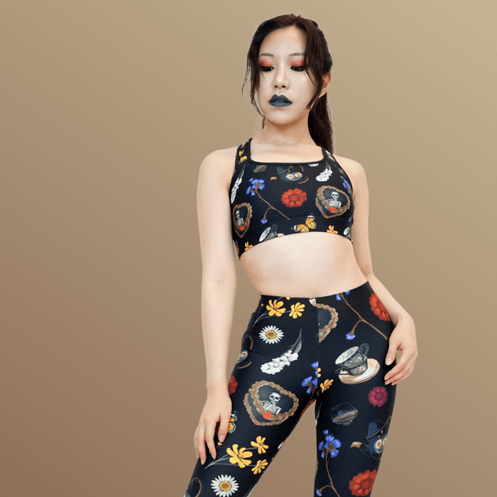 Gothic Tea Time sports bra in black with red dahlias and stacked teacups, gothic activewear