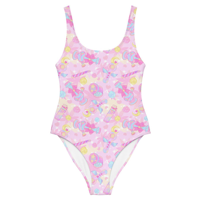 Indica Magica kawaii one-piece swimsuit in pink with winged star-tipped pipes and gold stars