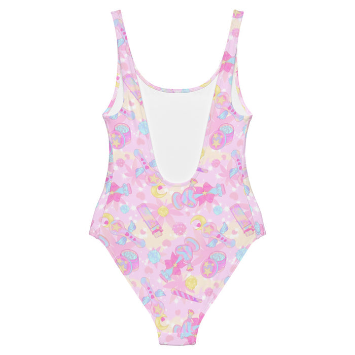 Indica Magica kawaii one-piece swimsuit in pink with candy-striped joints and crescent moons