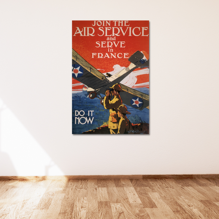 Vintage 1917 recruitment poster on a white wall for the U.S. Air Service, urging enlistment to serve in France. Features a plane and two soldiers with the text Join the Air Service and Serve in France. Do it Now.