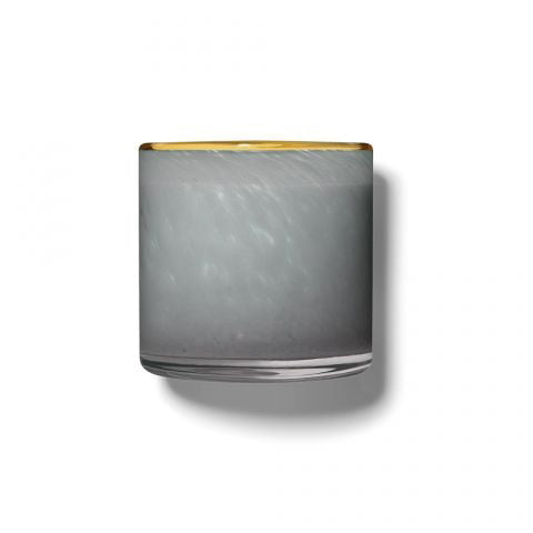 The LAFCO - SEA DUNE, BEACH HOUSE 6.5OZ features a clear glass tumbler with grey-tinted sides and a gold rim, its thick base casting a soft shadow to the right on a white background.
