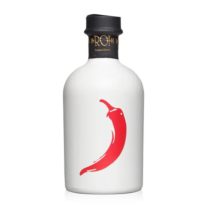 A white bottle with a black cap displays a bold red chili pepper illustration, gold and black decorative text on the neck, and contains MERCATO DI BELLINA - ITALIAN CHILI PEPPER INFUSED OLIVE OIL.