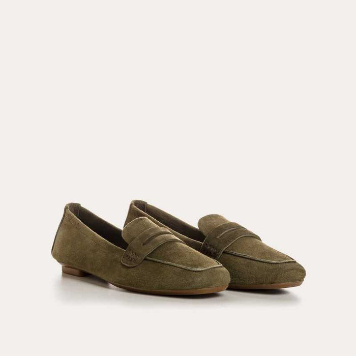 REQINS - HEMA suede loafers in olive feature a classic silhouette, flat sole, decorative upper strap, and comfortable leather insole, shown in side profile against a plain light background.