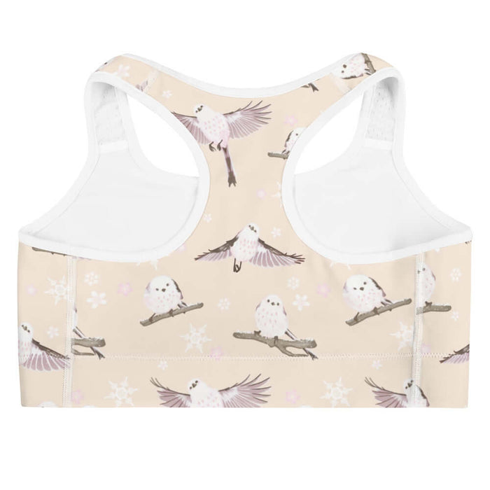 Snow Bird kawaii sports bra in soft pastels with mid-flight birds and falling snow