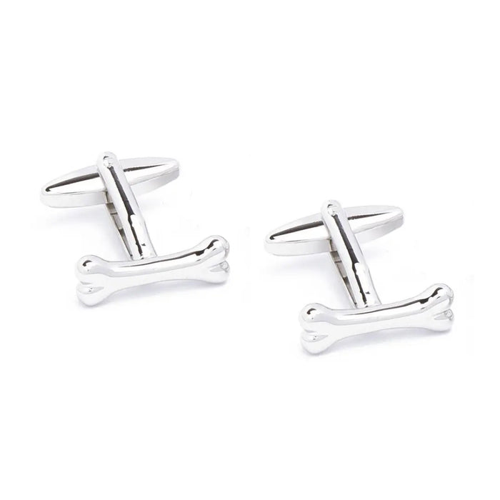 STOLEN RICHES - BONE CUFFLINKS: Stylish silver cufflinks by STOLEN RICHES, uniquely crafted in bone shapes and shown on a white background—an eye-catching twist for men’s accessories.