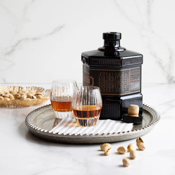 The VIETRI - CAPRI COCKTAIL NAPKIN, BLUE features a square white fabric with evenly spaced vertical blue stripes—an absorbent and stylish choice for any table setting from VIETRI.