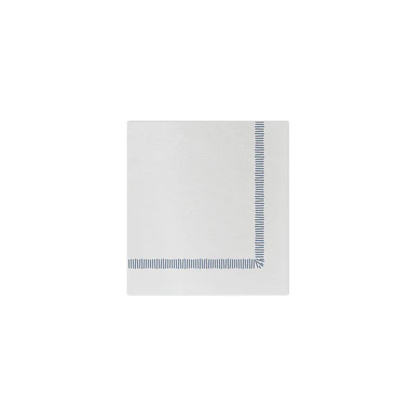 The VIETRI Fringe Cocktail Napkin, crafted from Italian spunlace, features a decorative green border on two adjacent sides forming a right angle. Ideal for cocktails, its design showcases evenly spaced vertical lines on a plain white background.