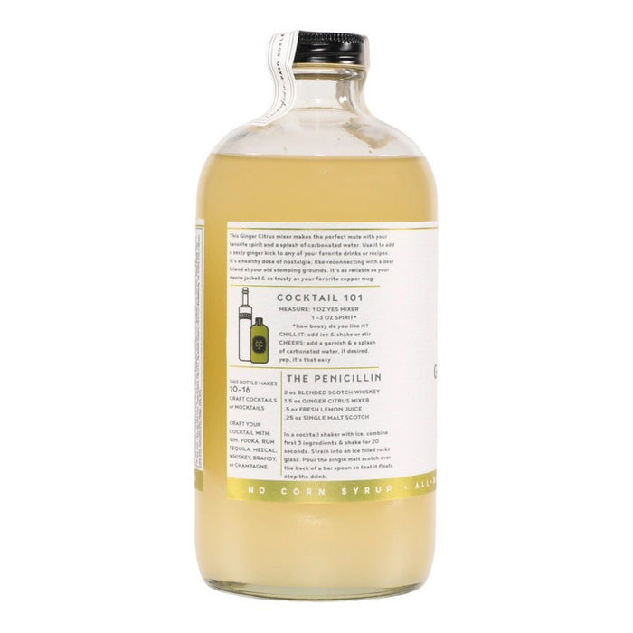 A clear glass 16 fl oz (473 ml) bottle of YES COCKTAIL CO - GINGER CITRUS COCKTAIL MIXER with a white label, green accents, and black text. The pale yellow mixer delivers a zesty ginger citrus kick—perfect for mule cocktails.